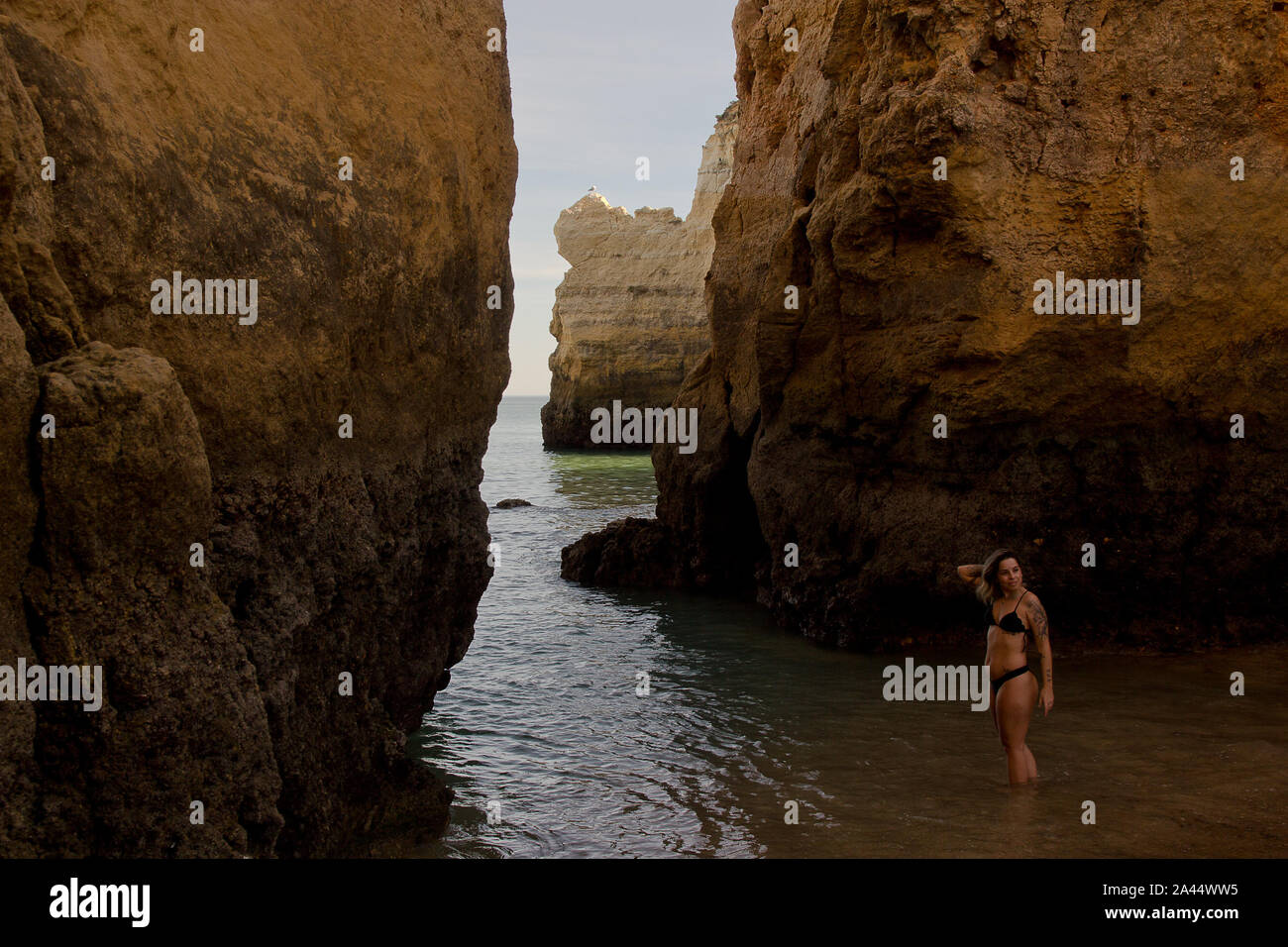 The Lagos arch (Portugal) - with pretty girl as added bonus Stock Photo