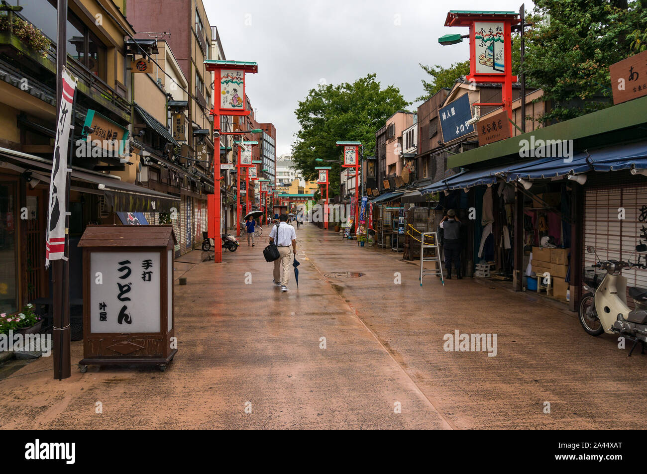 Tokyo, Japan - Aug 29, 2016: side street with Kanoya Udon Shop (text on billboard) and souvenir shops near Senso-ji temple, Asakusa district. Small st Stock Photo