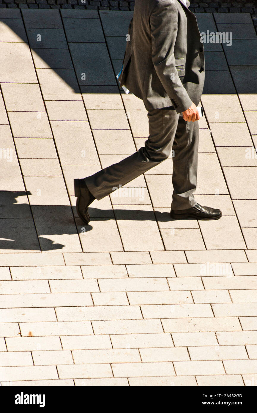 Man walking suit hi-res stock photography and images - Alamy