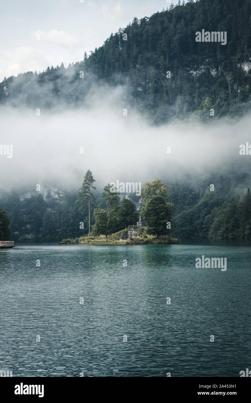 The island Christlieger in the fog at the Koenigssee (Königssee) in the Berchtesgadener Land, Bavaria, Germany Stock Photo