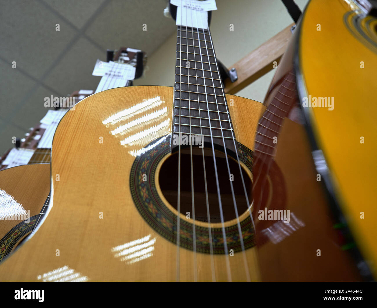Classic sixstringed wooden guitars closeup shot in a musical