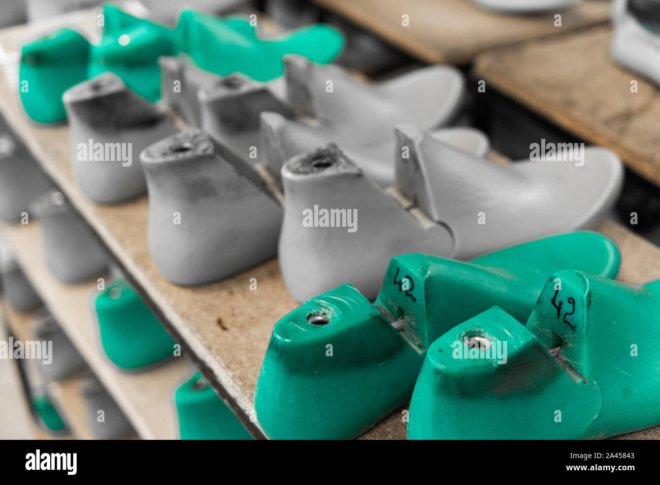 Plastic lasts used in the manufacture of shoes. Row of plastic shoe