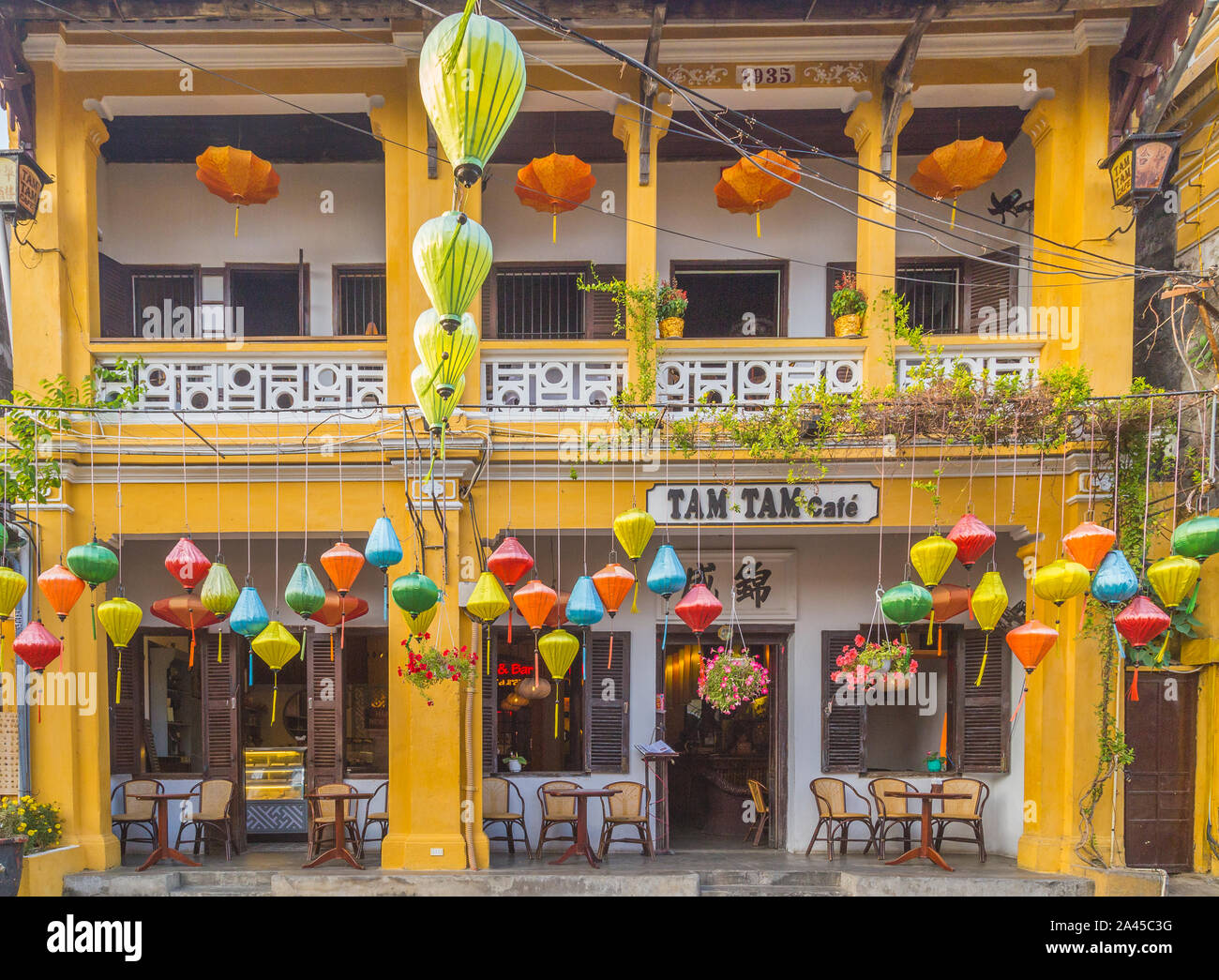 HOI AN, VIETNAM - 24TH MARCH 2017:  The outside of Tam Tam cafe in Hoi An ancient Town. Colourful architecture and lanterns can be seen. Stock Photo