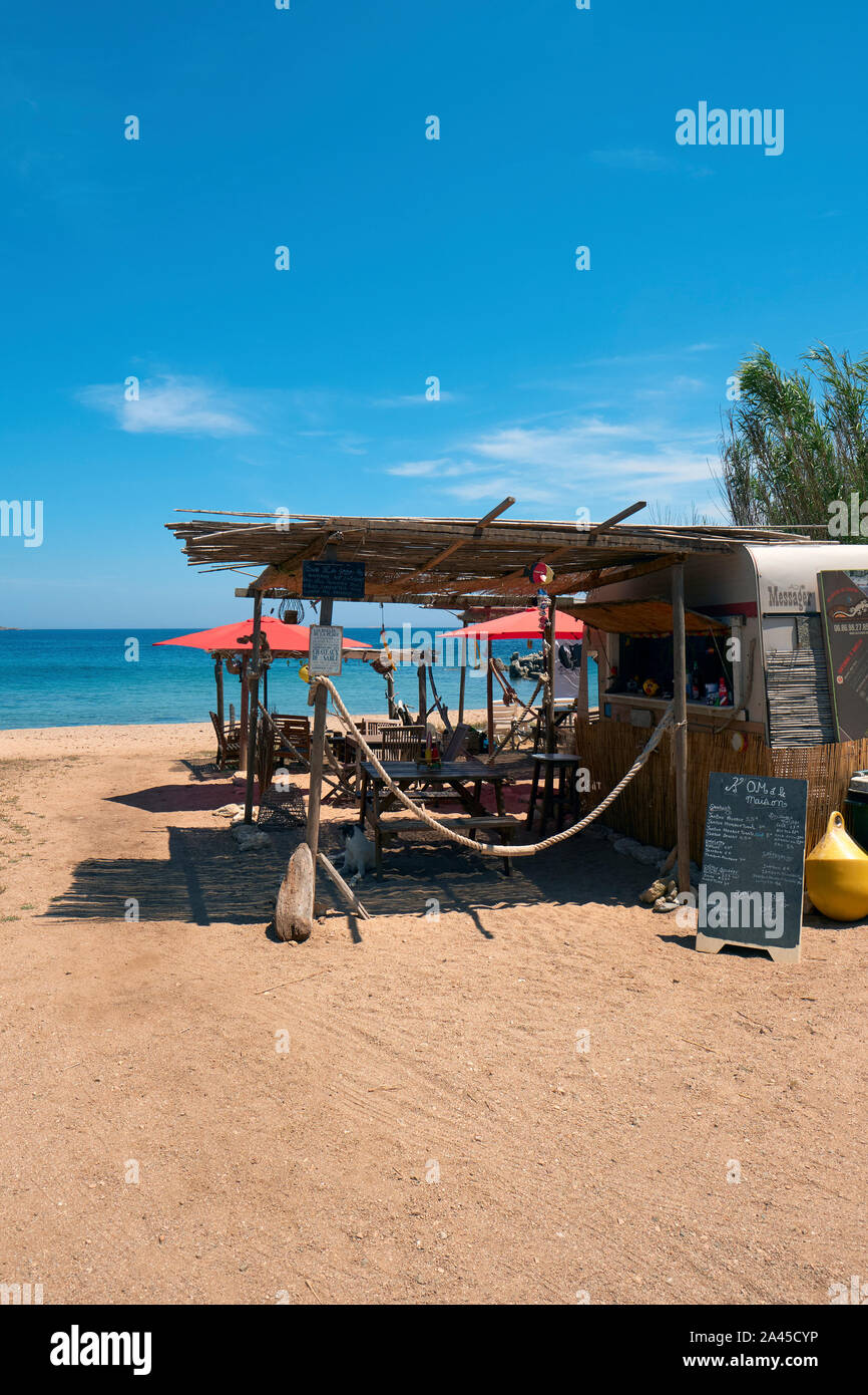 A rustic summer beach bar cafe shack / cabana in Corsica France - Corsica beach cafe Stock Photo