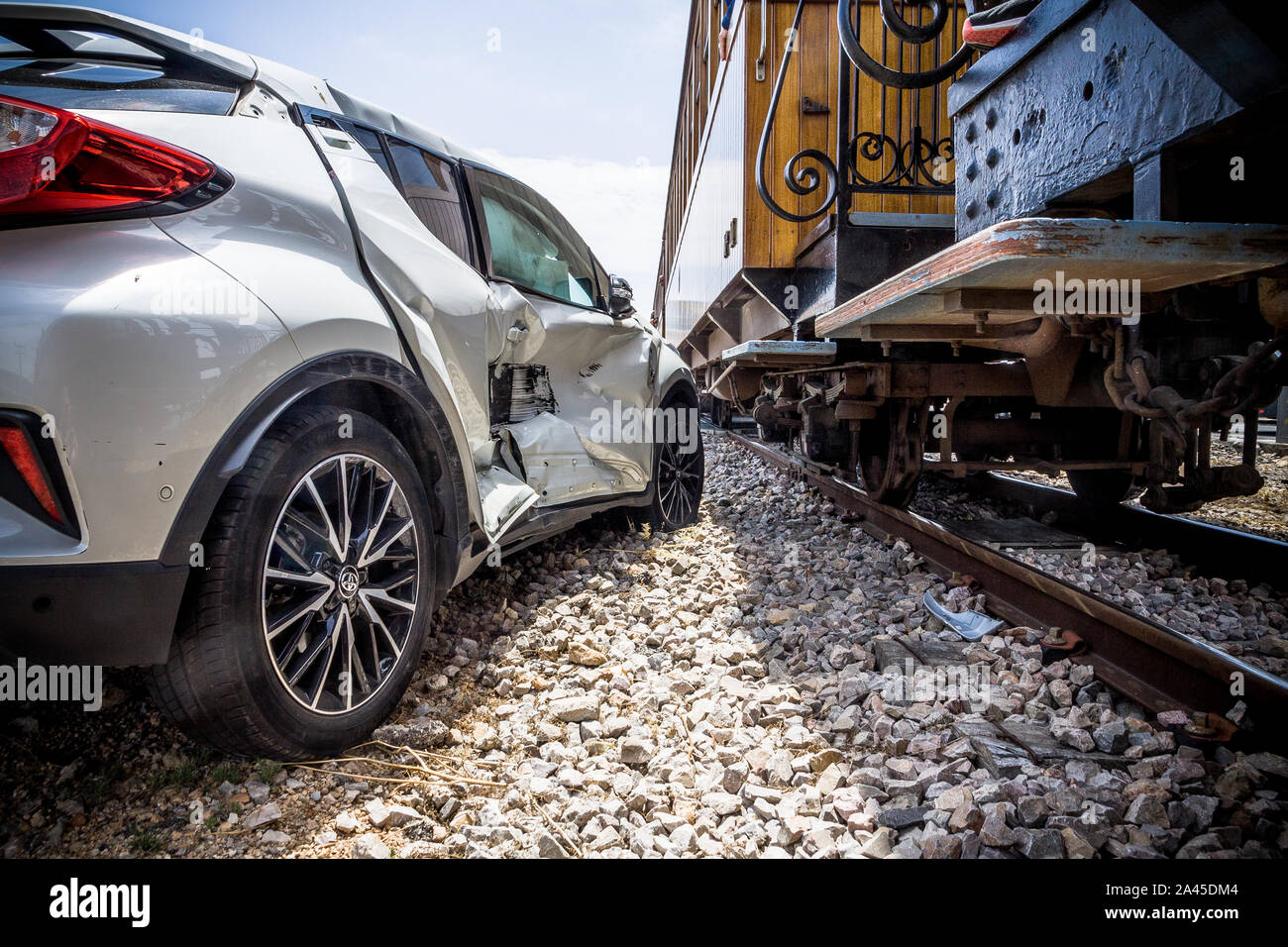 Damaged car after car accident with a train Stock Photo