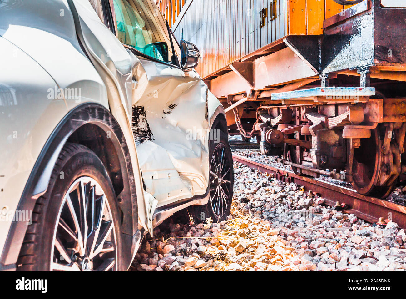 Damaged car after car accident with a train Stock Photo