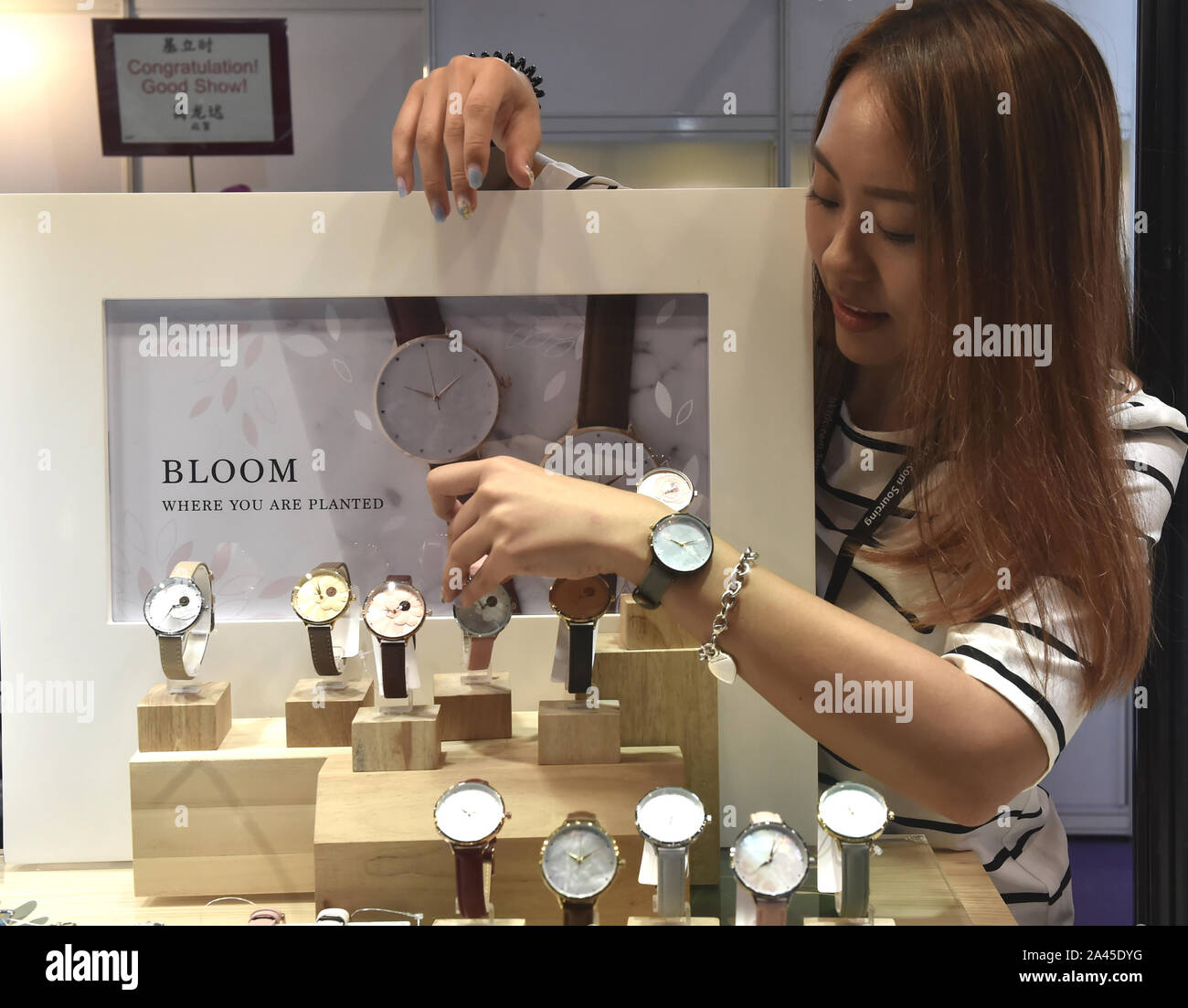 A staff introduces watches at the 38th Hong Kong Watch and Clock Fair