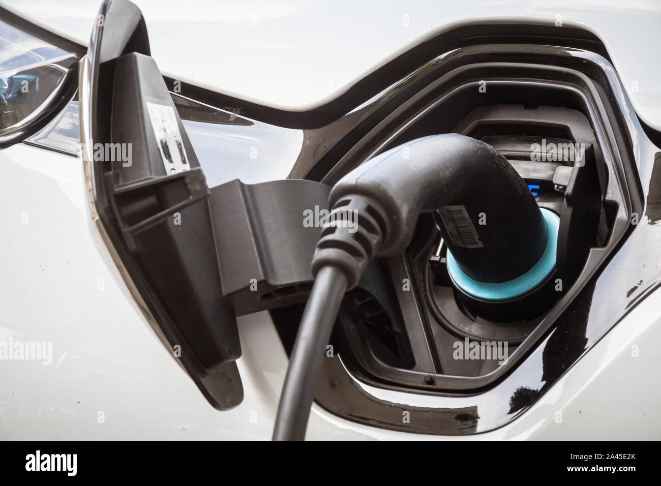 Electric car plug during charging Stock Photo Alamy