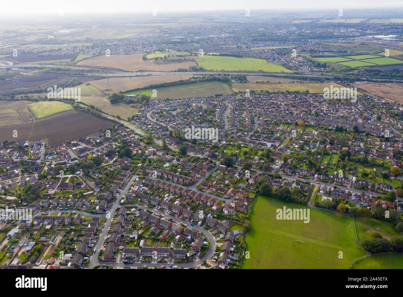 Aerial photo of the town of Castleford in the district of Wakefield in the UK, showing roof top view of typical UK rows of houses and streets. Stock Photo