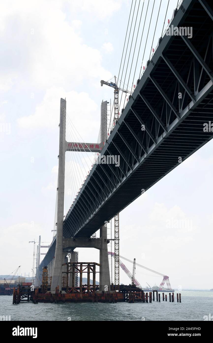 Chinese workers labor at the Pingtan Strait Road-rail Bridge, the world's longest cross-sea road-rail bridge, in Fuzhou city, southeast China's Fujian Stock Photo