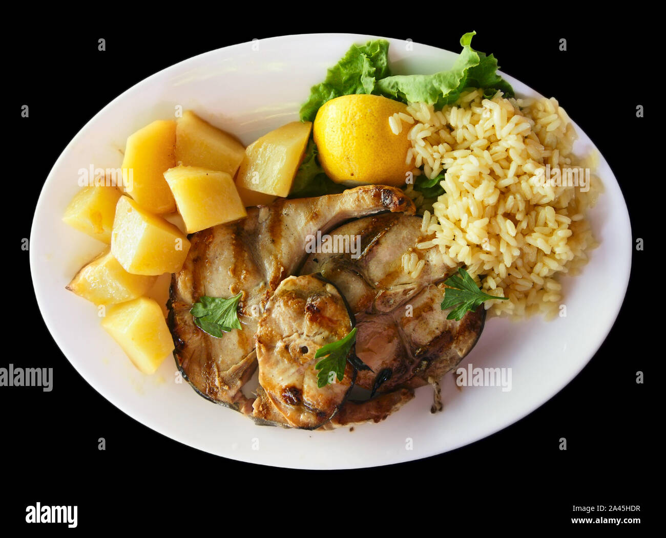 Grilled mackerel with rice and potatoes Stock Photo Alamy