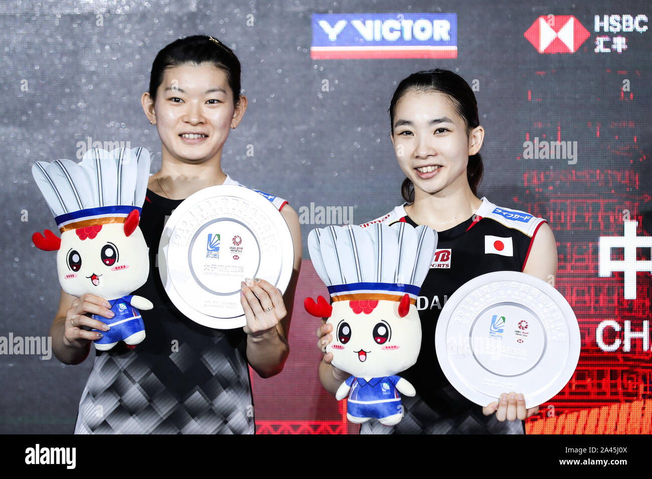 Japanese professional badminton players Misaki Matsutomo, right, and