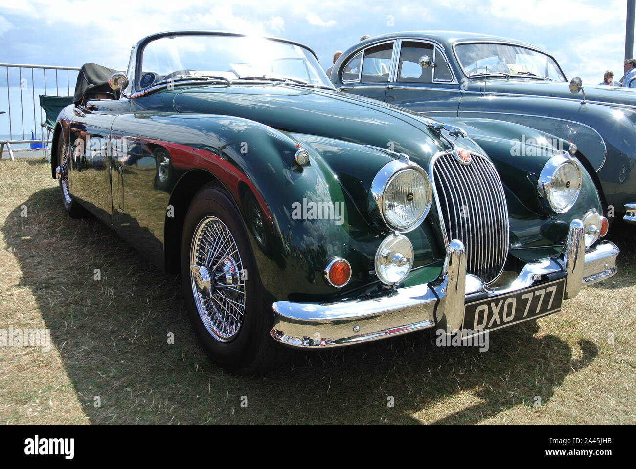 A 1959 Jaguar XK150 parked up on display at the English Riviera classic