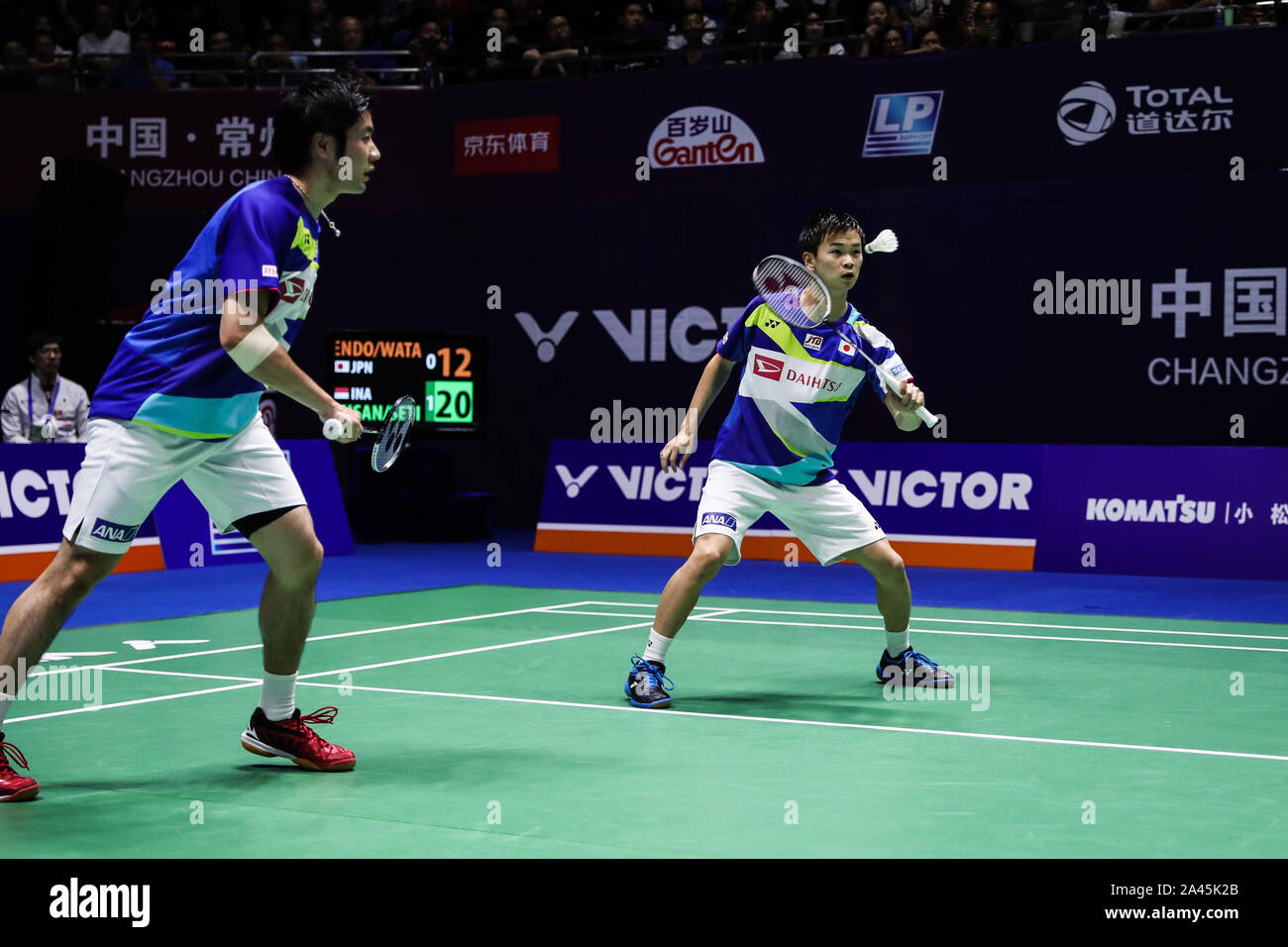 Hiroyuki Endo and Yuta Watanabe of get the ball against Hendra Setiawan and Mohammad Ahsa of