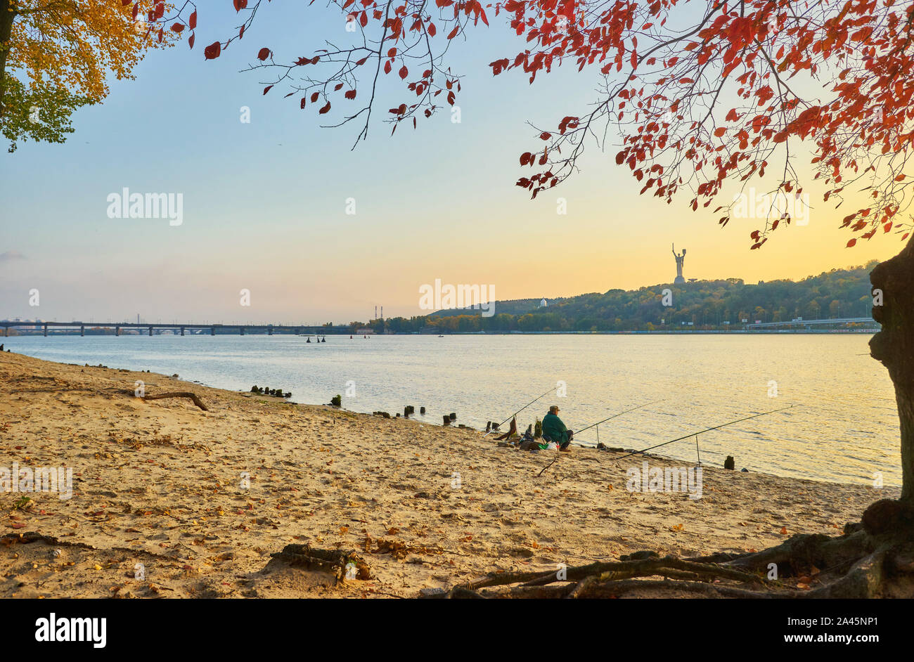Autumn park, city panoramic view, Paton bridge with blue sky and clouds ...