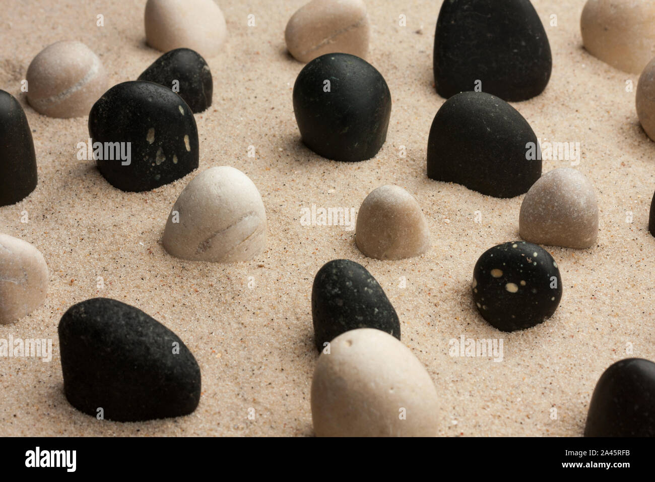 Rock garden. Stones sticking out of the sand in the sunlight. Spa background Stock Photo