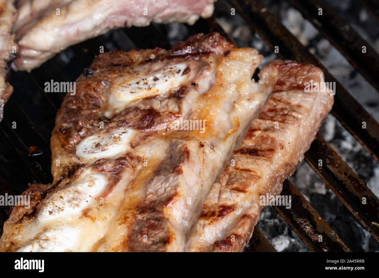 Barbecue grill with grilled pork ribs. Spanish churrasco Stock Photo