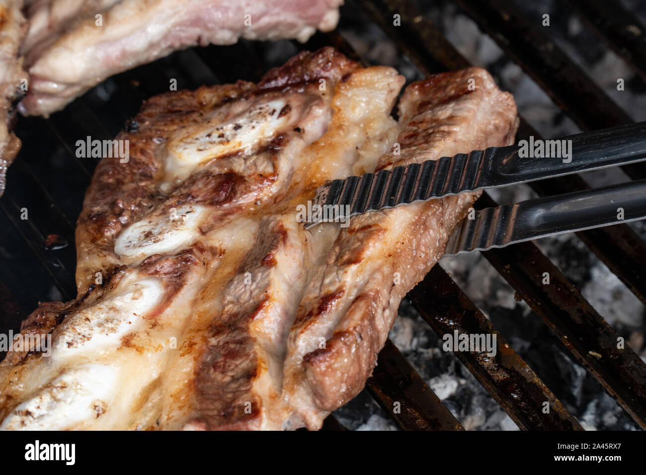 Barbecue grill with grilled pork ribs. Spanish churrasco Stock Photo