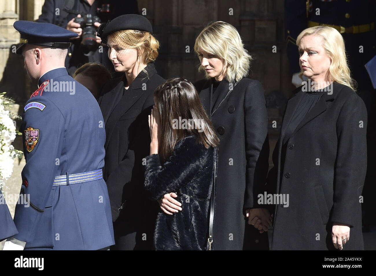 Czech Republic, October 12th, 2019. (L-R) Karel Gott's widow Ivana Gottova,  daughters Charlotte Ella Gottova, Lucie Kovarikova and Dominika Gottova  leave the St Vitus Cathedral at the Prague Castle after the mourning