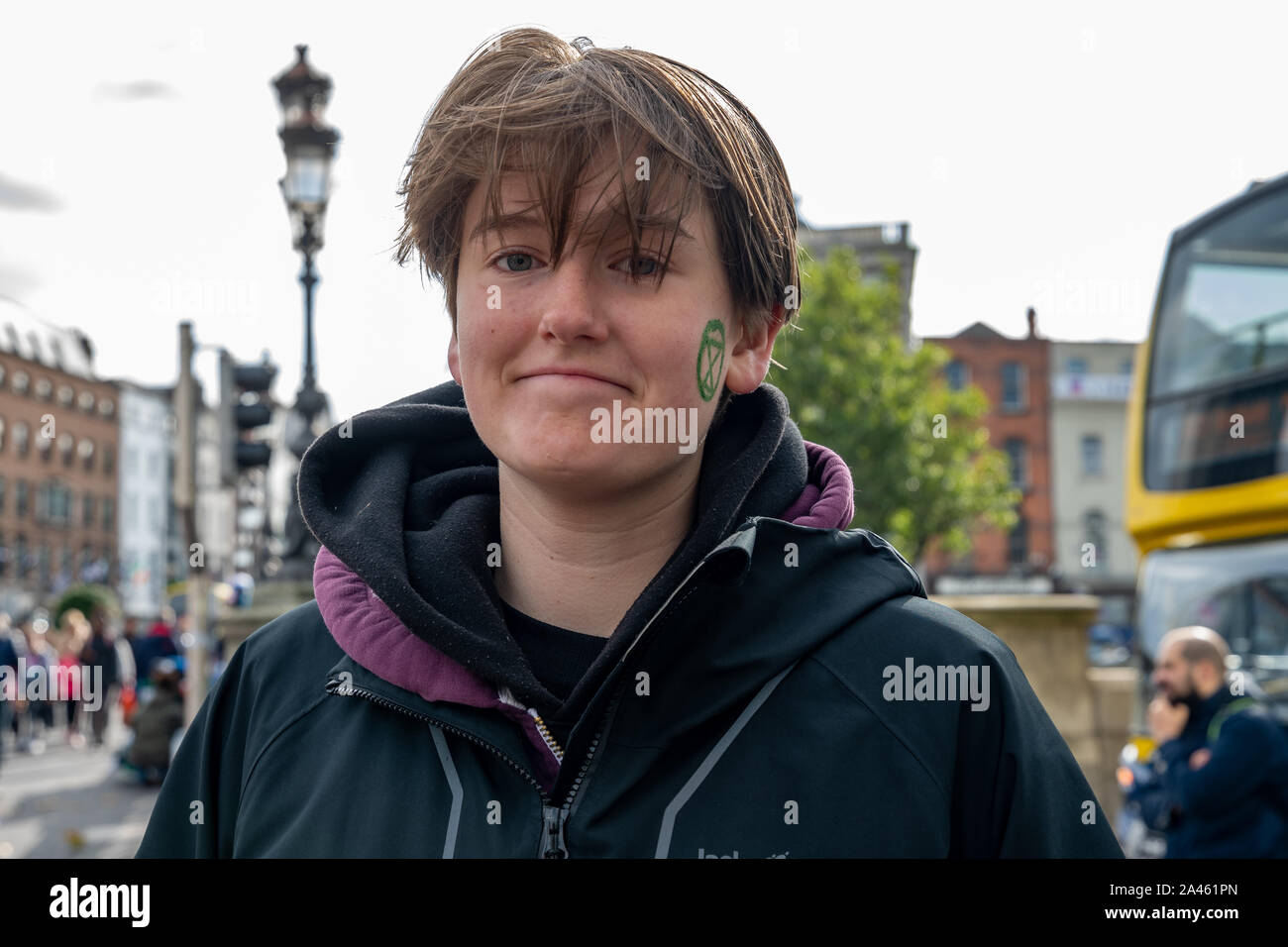 Portrait of a young protester during Extinction Rebellion week of protest in Dublin, Ireland. Stock Photo