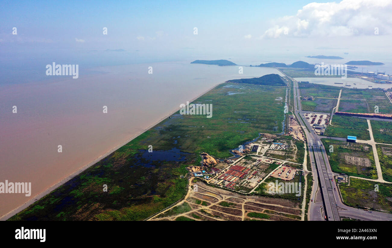 An aerial view of seacoast and harbor at Yangshan Port, a deep water port for container ships in Hangzhou Bay, which contributes 43.9% to the total th Stock Photo