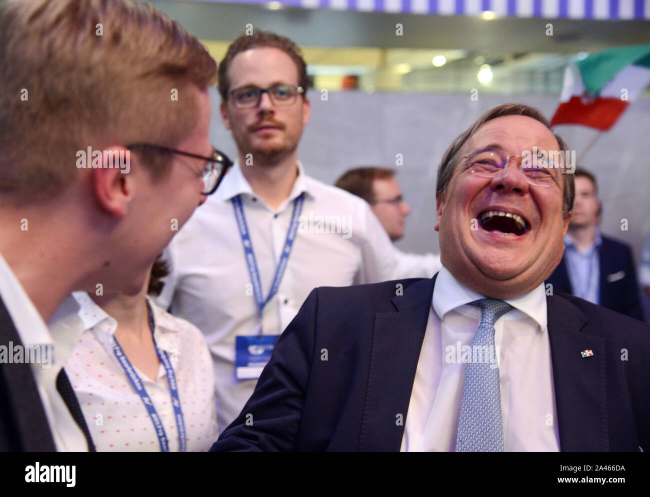 12 October 2019, Saarland, Saarbrücken: Armin Laschet (r, CDU), Prime  Minister of North Rhine-Westphalia, laughs in conversation with Philipp  Amthor (l) at the Germany Day of the Young Union. Laschet did not