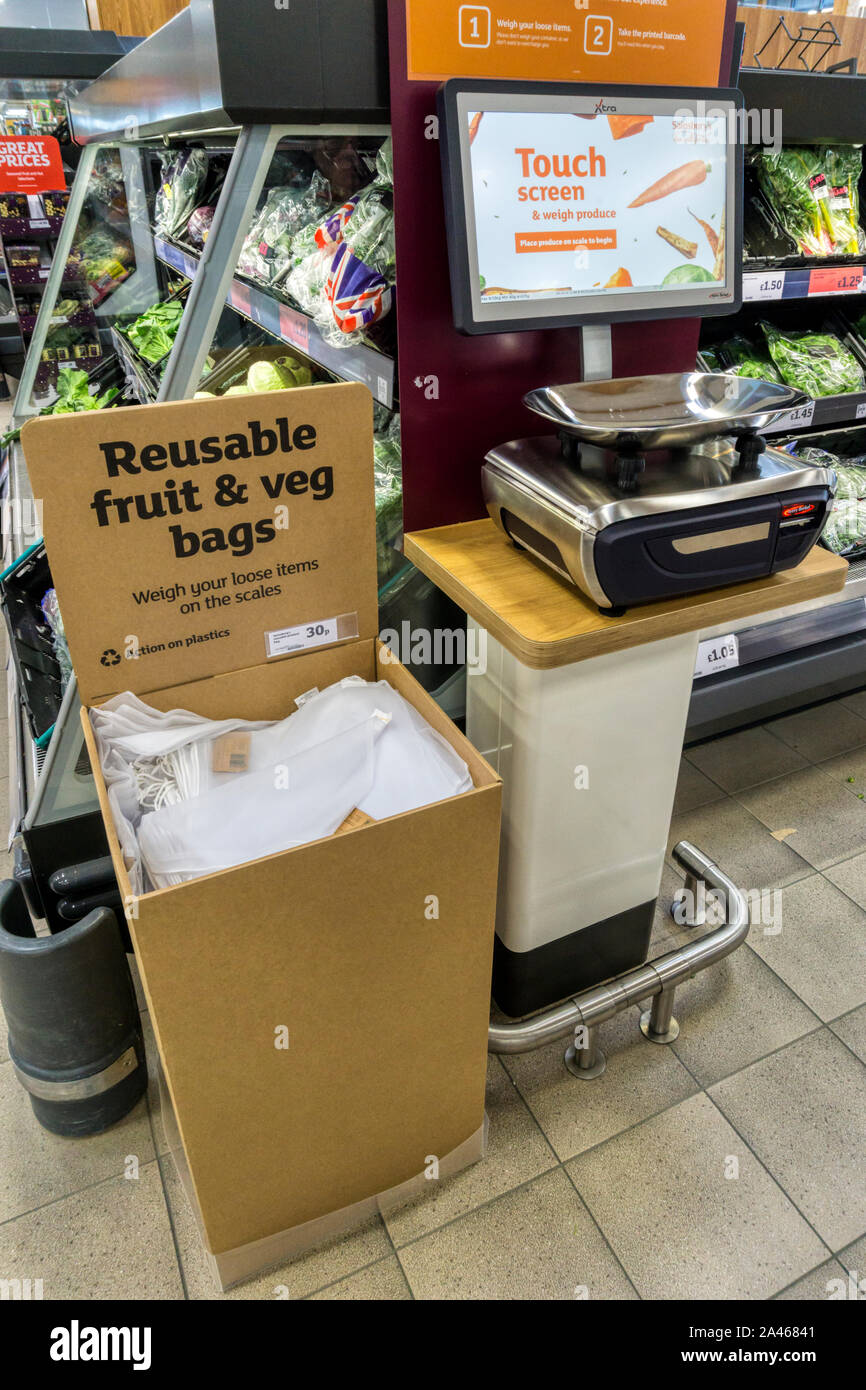 Reusable fruit & veg bags introduced for loose fruit & vegetables in a Sainsbury's supermarket. Stock Photo