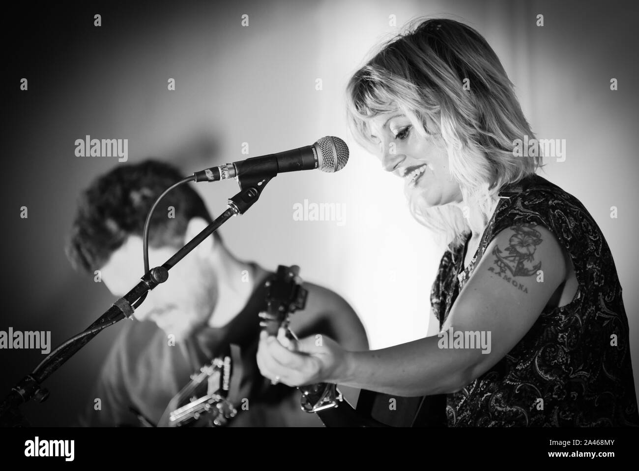 Indie singer/songwriter and Hadestown creator Anais Mitchell performs in Burlington, VT, USA, with guitarist Austin Nevins. Stock Photo