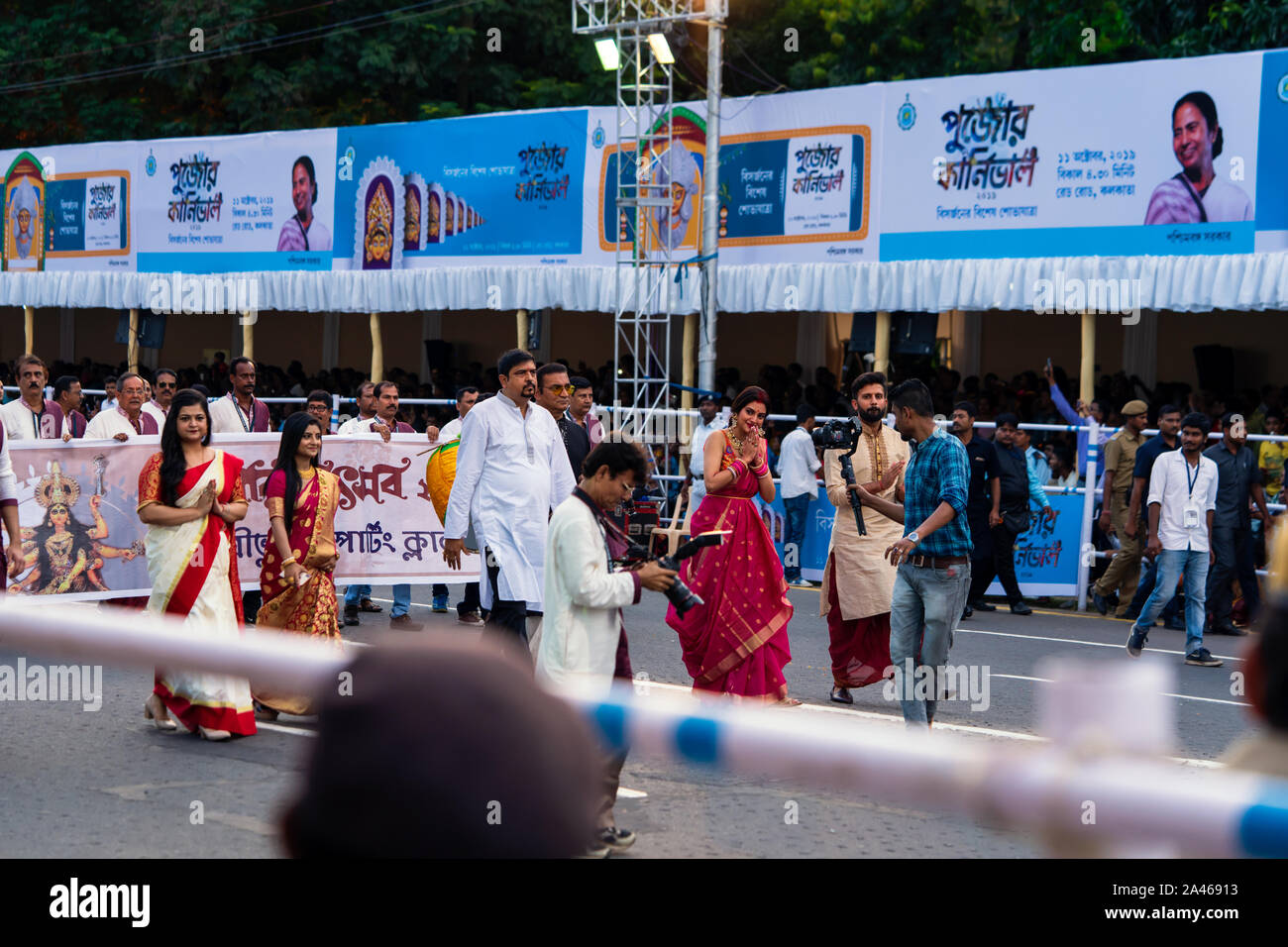 Celebrities like Nusrat Jahan, Nikhil Jain, Abhijeet bhattacharya, sujit bose are marching or walking though red road at puja carnival in Kolkata orga Stock Photo