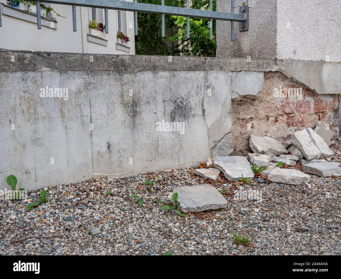 House wall with structural damage in the wall plaster Stock Photo