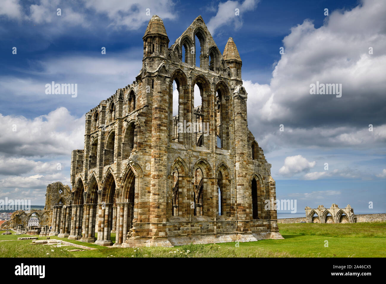 Gothic ruins of 13th Century Whitby Abbey church and Abbey House on the North Sea Whitby North York Moors National Park England Stock Photo