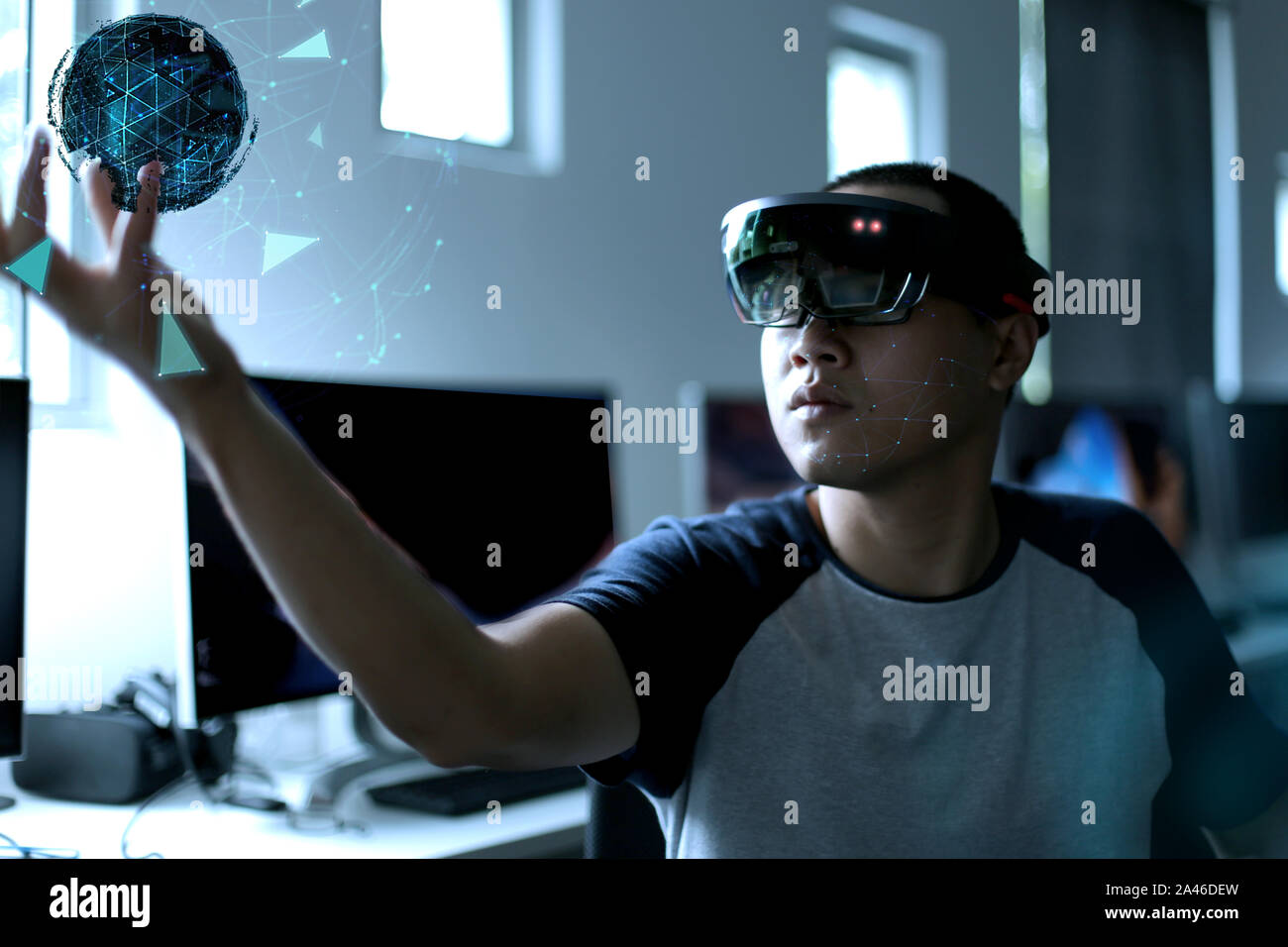Student experience Virtual Reality with HoloLens glasses. Mixed reality future technology concept Stock Photo