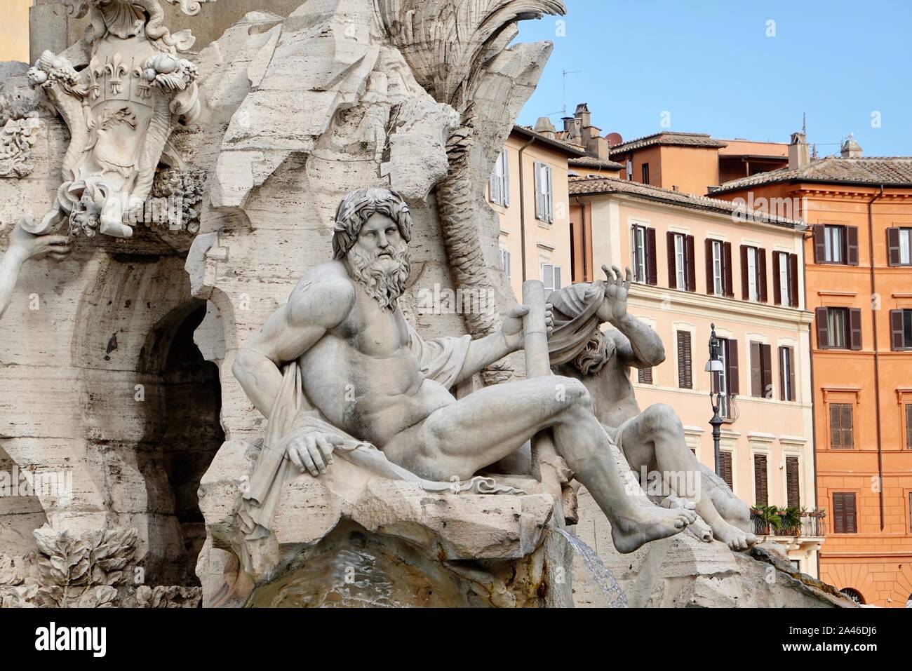 Detail of the River god Ganges, Fontana dei Quattro Fiumi, Fountain of the  Four Rivers, designed by Bernini, Piazza Navona with buildings, Rome, Italy  Stock Photo - Alamy