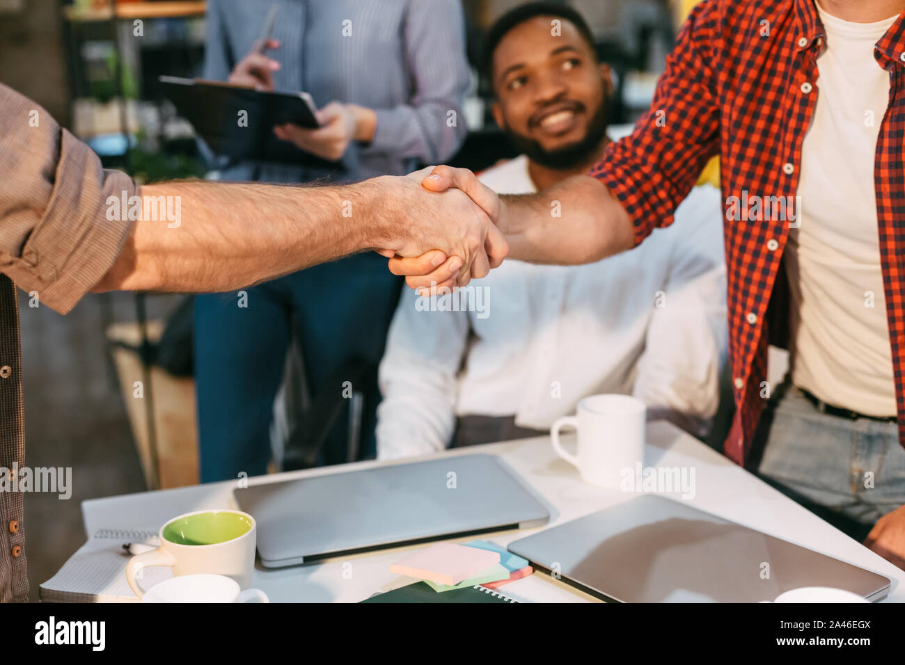 Successful deal. Businessman shaking hands with business partner Stock Photo