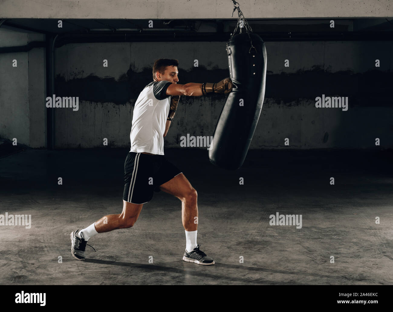 Professional boxer training at gym, practicing kicks and punches Stock ...