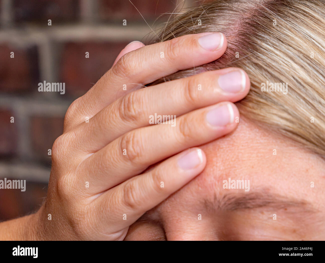young Woman has a headache Stock Photo
