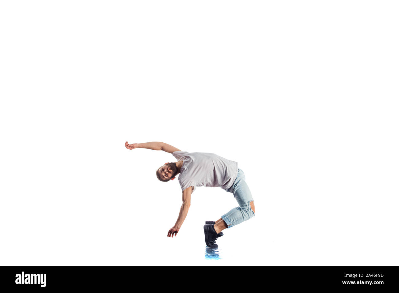 Amazing dancer is doing breakdance on a white background Stock Photo