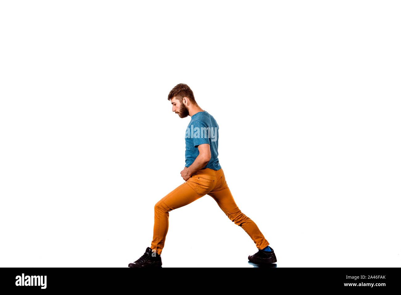 An urban guy is doing breakdance in the studio Stock Photo
