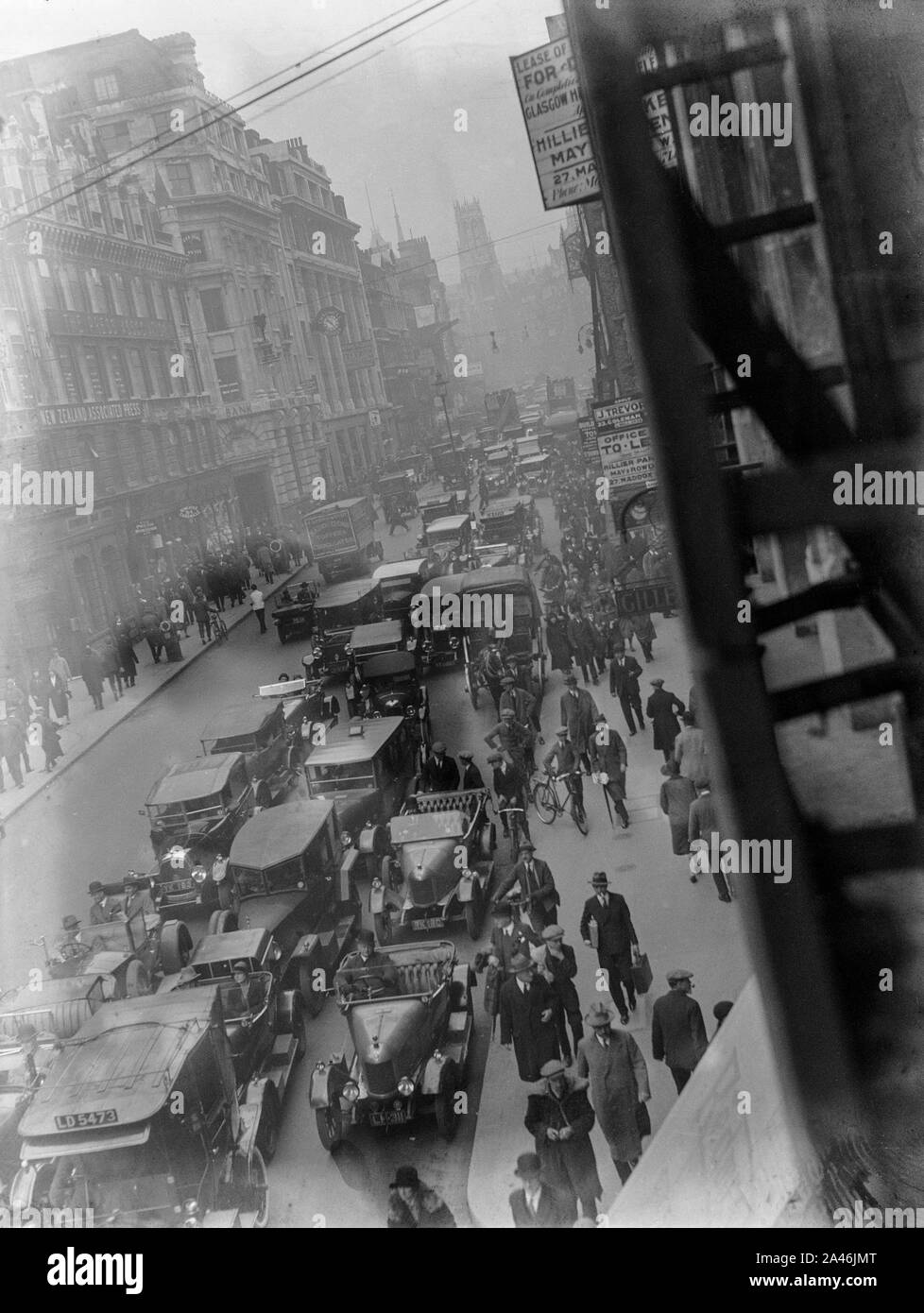 4th May 1926. Fleet Street, London, England. The streets of London busy with pedestrians and motor vehicles, as the general Strike begins to take hold. Soon, the streets would see the British Army in tanks and armoured cars, in an attempt to keep the peace and maintain basic services. Stock Photo