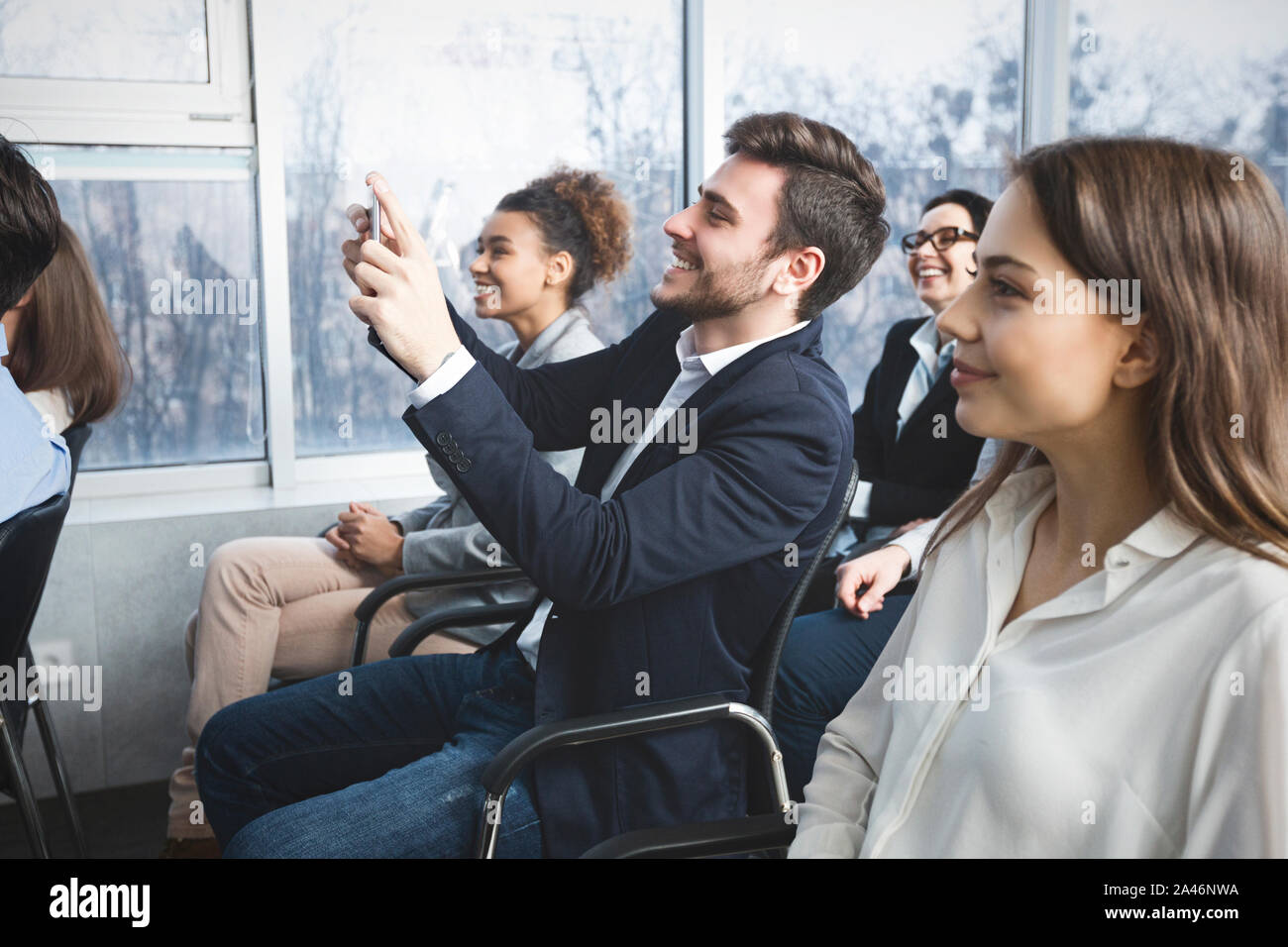 Phone Camera Inlecture Image Business man filming lecture on smartphone camera Stock Photo - Alamy