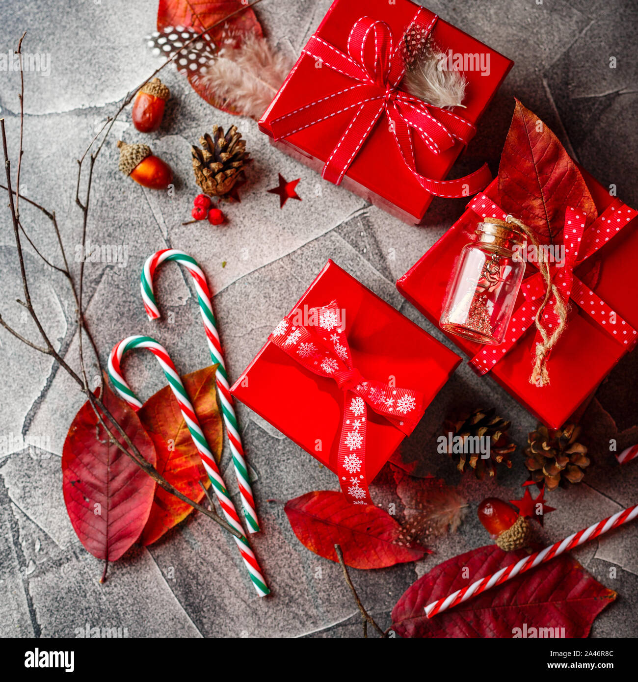 Christmas background with red gift boxes, candy canes, red autumn ...
