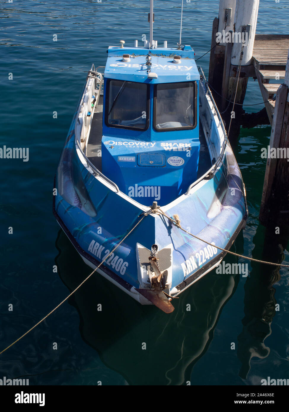 Blue Boat Tied To The Wharf Stock Photo