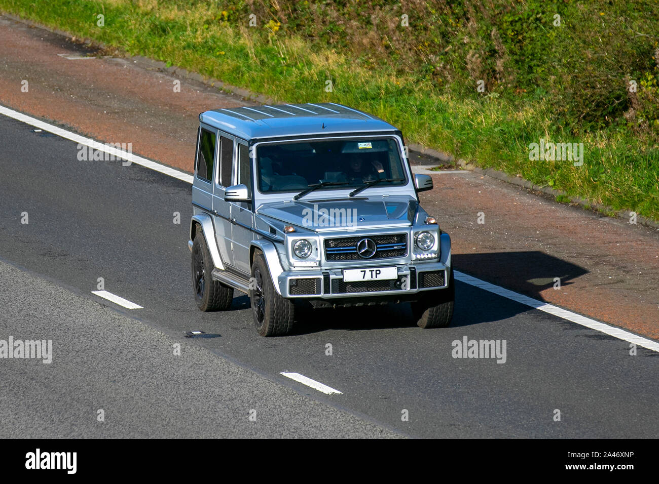 2015 silver Mercedes-Benz G 350 4matic D Auto; UK Vehicular traffic, transport, modern, saloon cars with private number plate, personalised, cherished, dateless, DVLA registration marks, registrations, south-bound on the 3 lane M6 motorway highway. Stock Photo