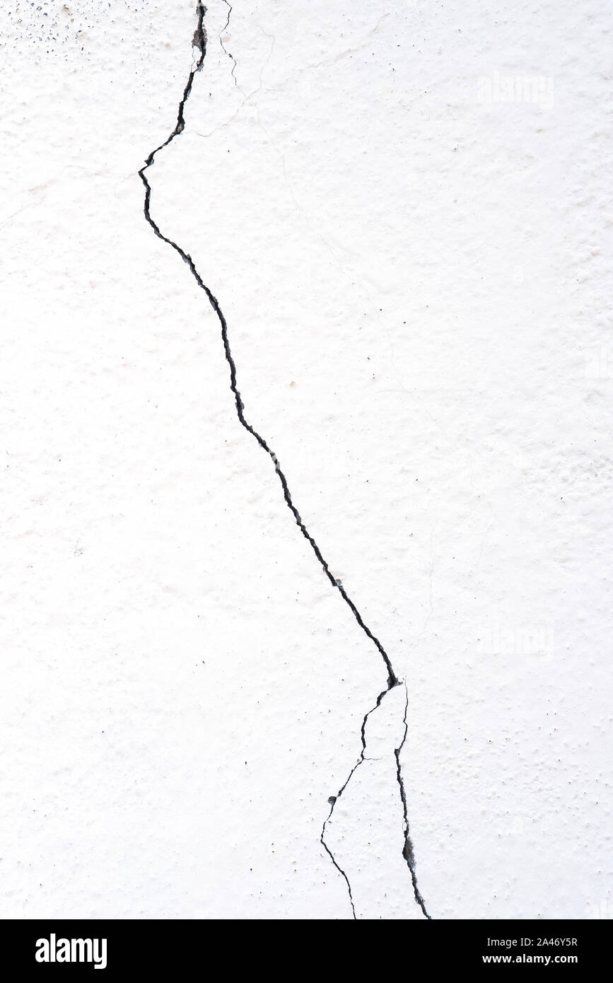 Crack on a white wall Stock Photo