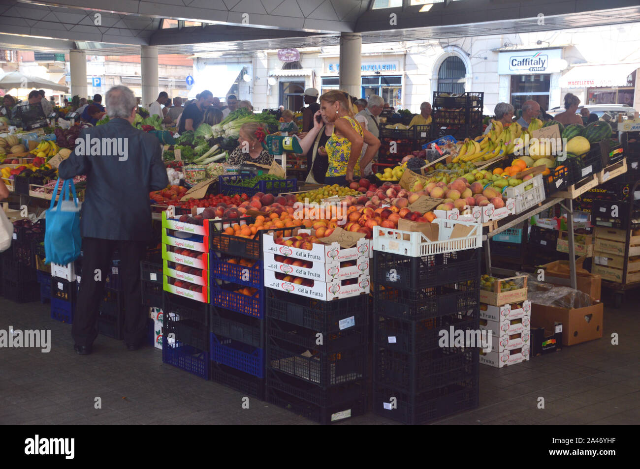 Shoppers & Stall Holders at a Fruit and Vegetable Stall in the Covered