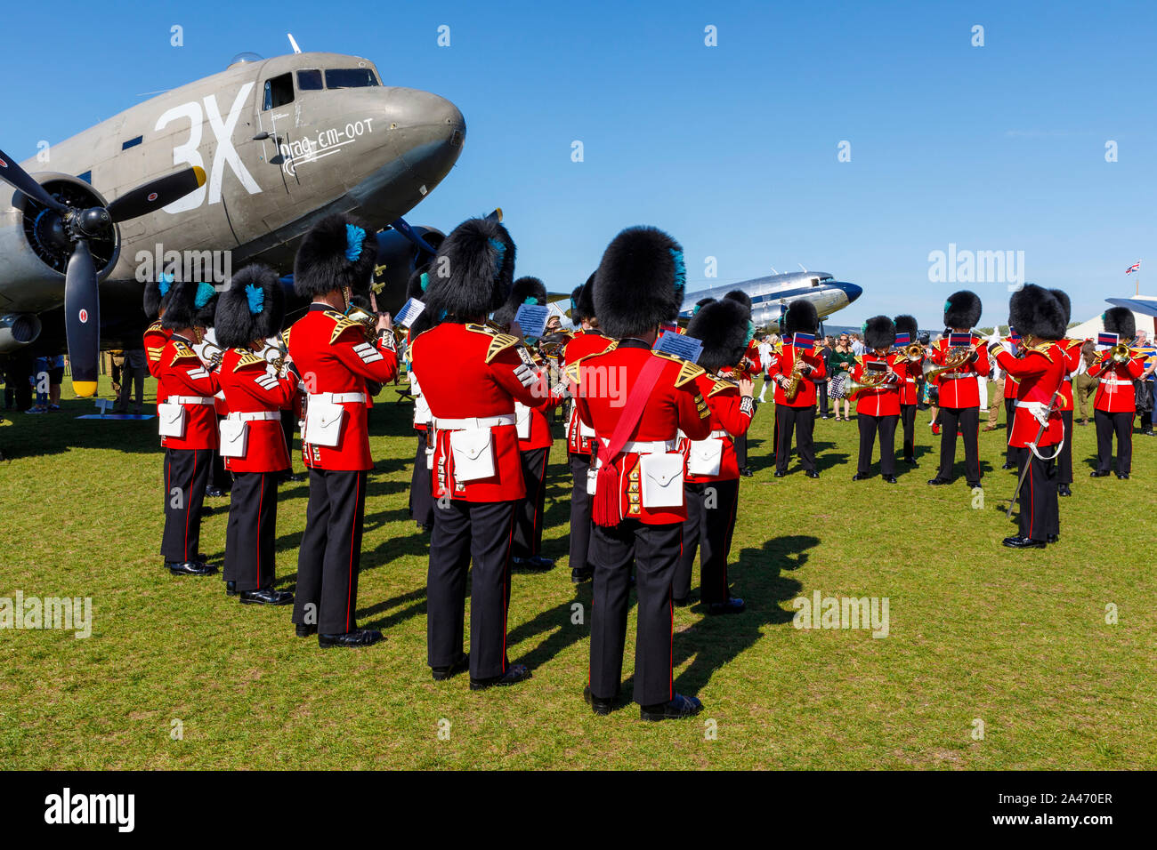1944 Douglas C-47 ‘Dakota’ Skytrain 'Drag 'Em Oot' at the 2019 Goodwood Revival, Sussex, UK. With the Band of the Irish Guards. Stock Photo