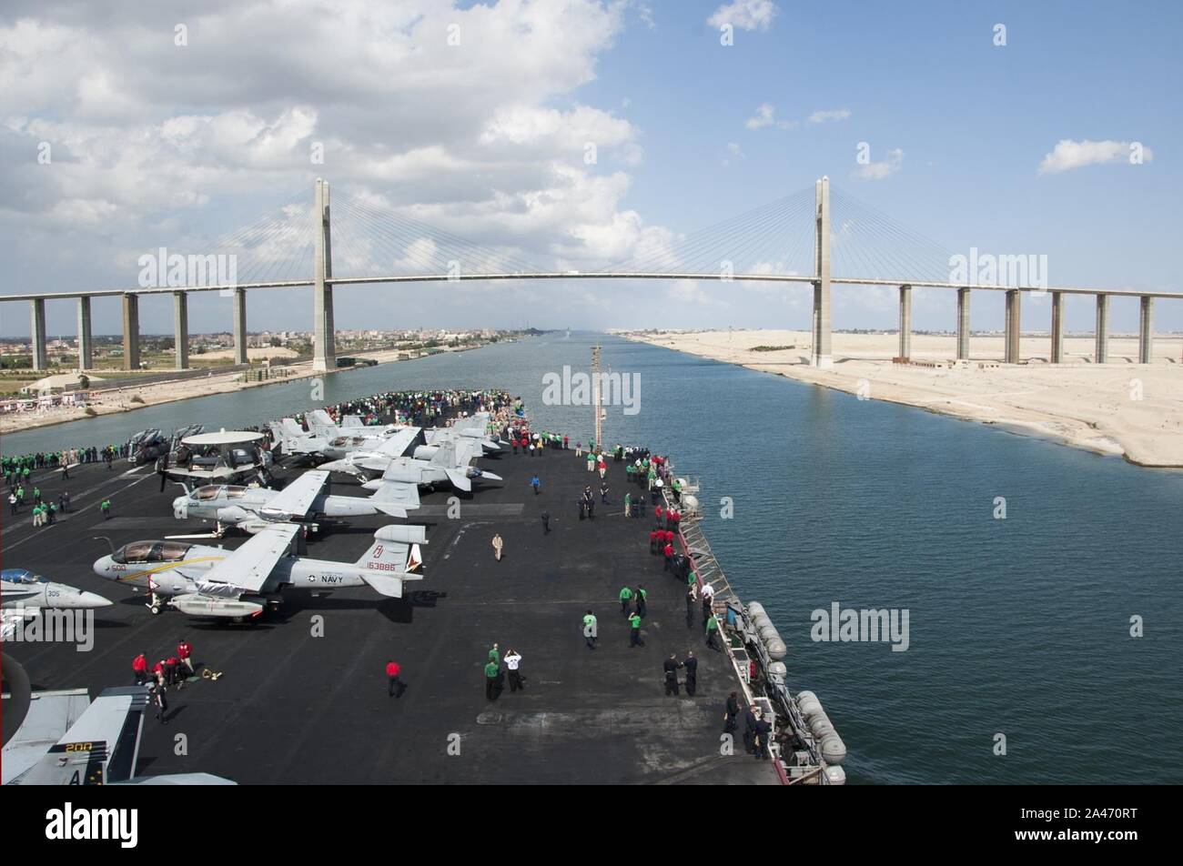 Flight deck of USS George H.W. Bush (CVN-77) and Suez Canal Bridge Stock Photo