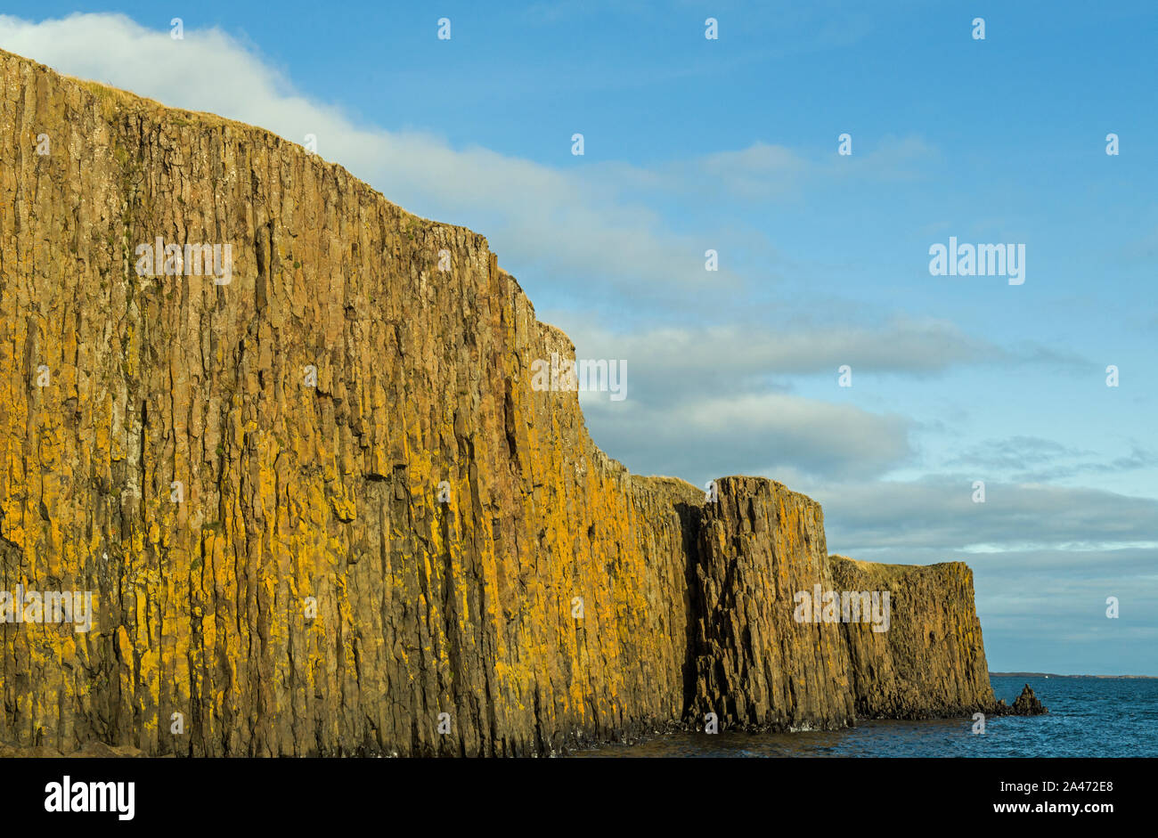 Sea cliffs at Sugandisey Island just off Styykisholmur on the Snaefellsnes Peninsular West Iceland Stock Photo