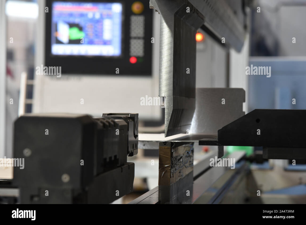 operator bending metal sheet by sheet bending machine bending of metal ...