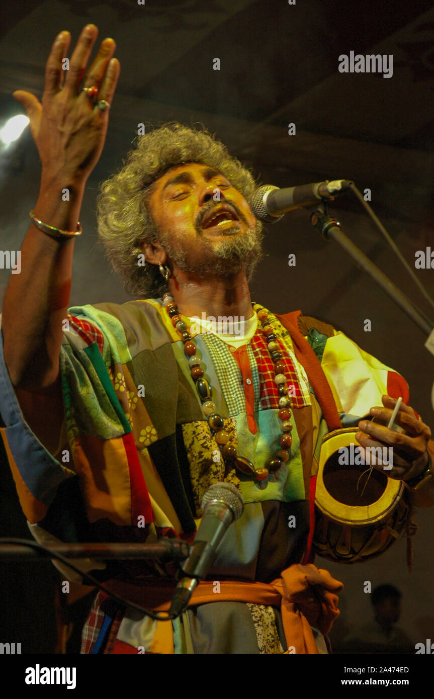 Paban Das Baul performs on a stage. He is known for pioneering traditional Baul music on the international music scene and for establishing a genre of Stock Photo